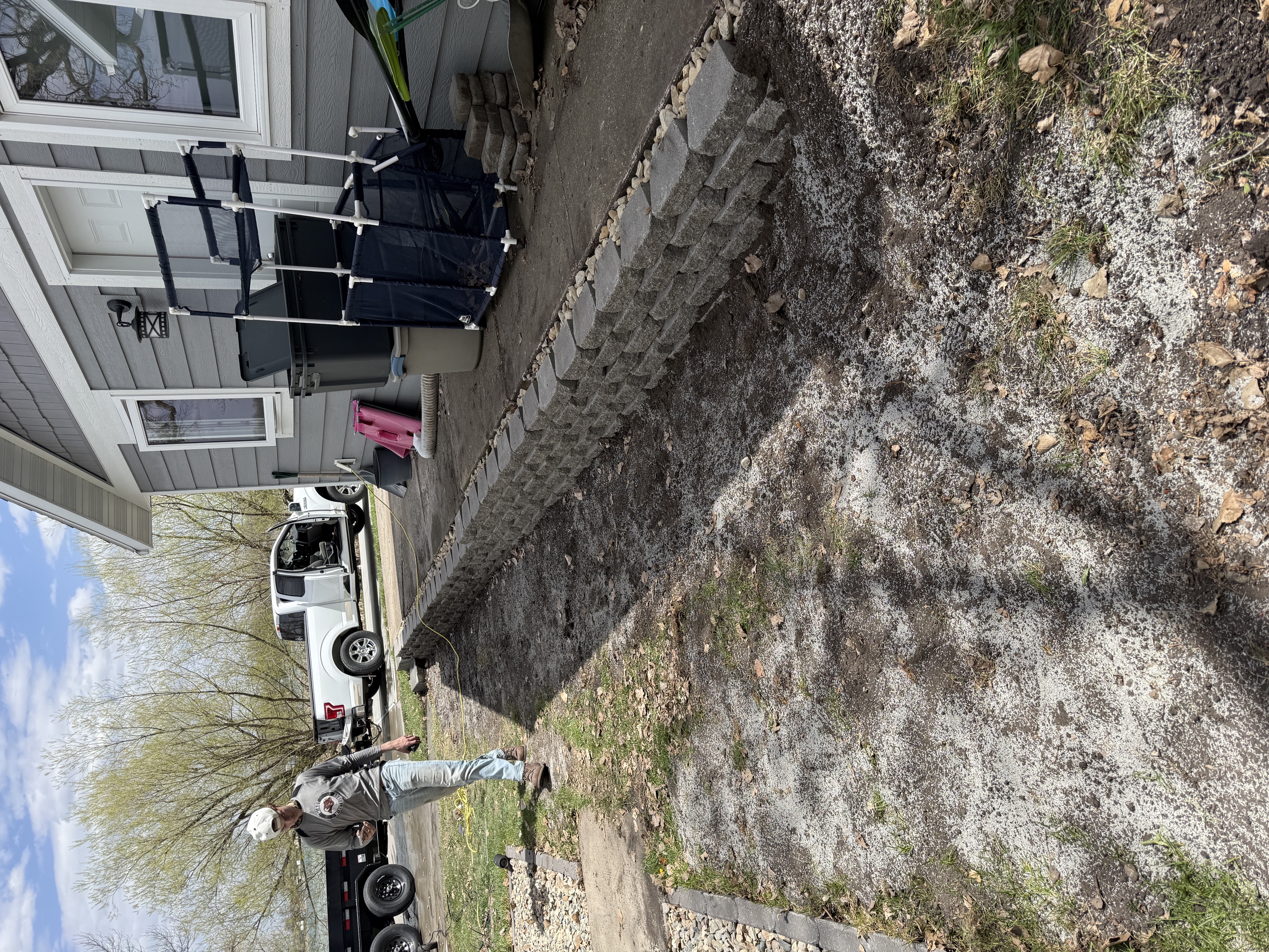Interlocking block retaining wall along a residential walkway